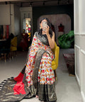 Black Dola silk sarees are known for their colourful diversity and geometric designs with patola print - ReadyToWearshop