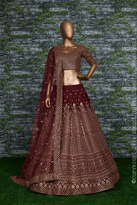 Maroon raw silk blouse adorned with gold sequin embroidery. lehenga choli for women - ReadyToWearshop